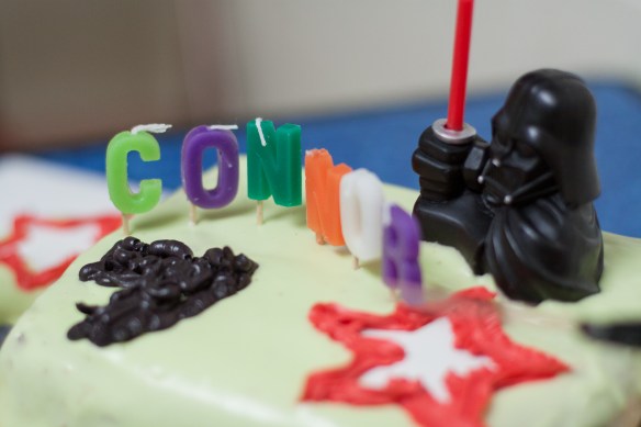 the cake. notice the seven candles. connor figured that out on his own at party city. connor equals six + one darth vader = seven